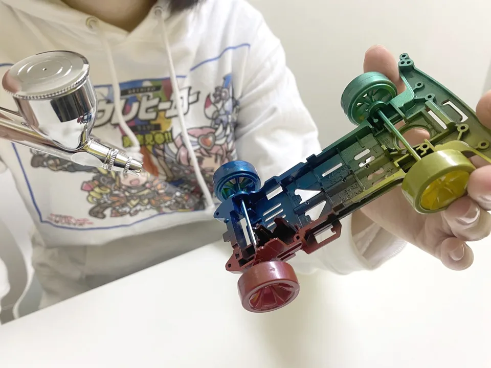 A mini 4WD chassis of mixed materials, airbrushed with UREHERO